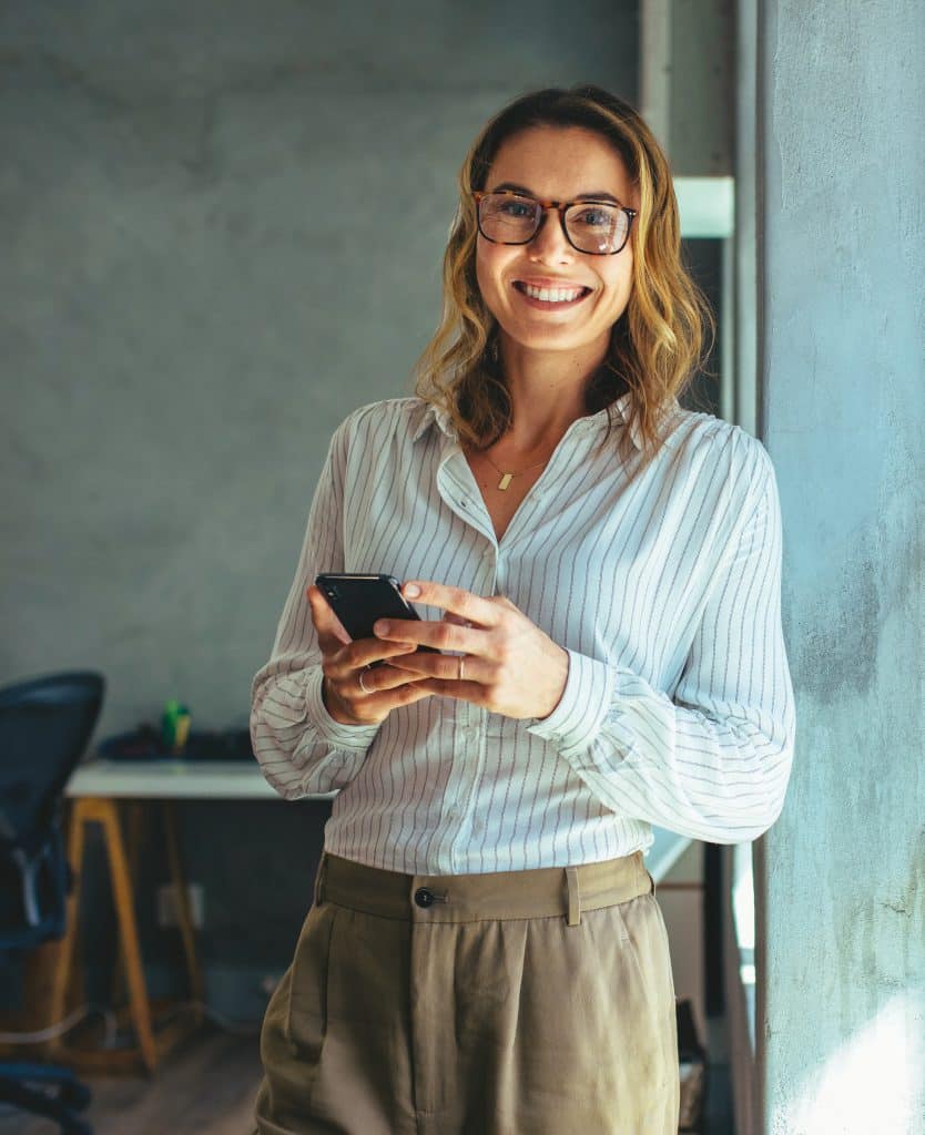 Smiling businesswoman at work in office
